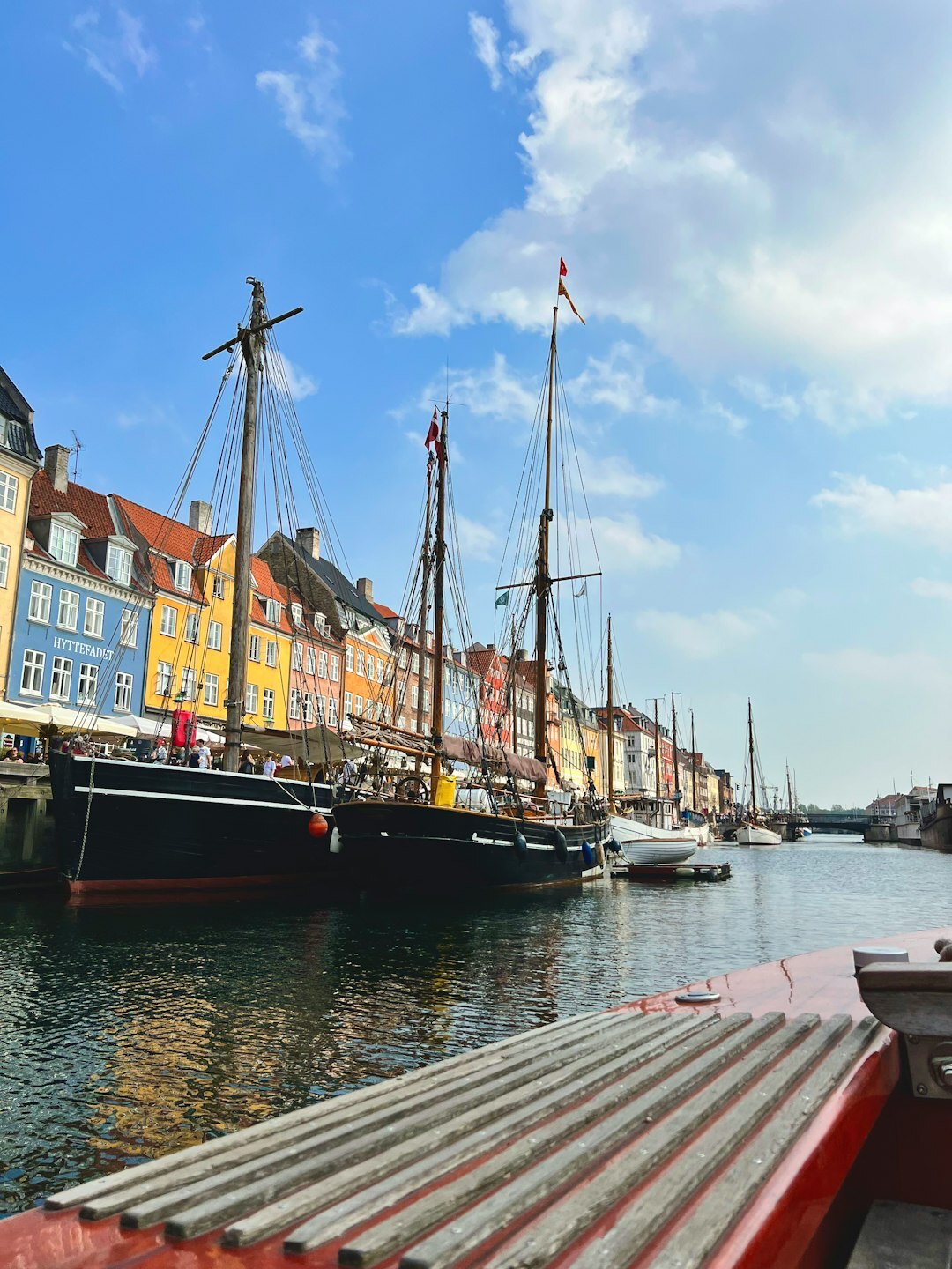 Small Danish fishing village with colorful houses and boats