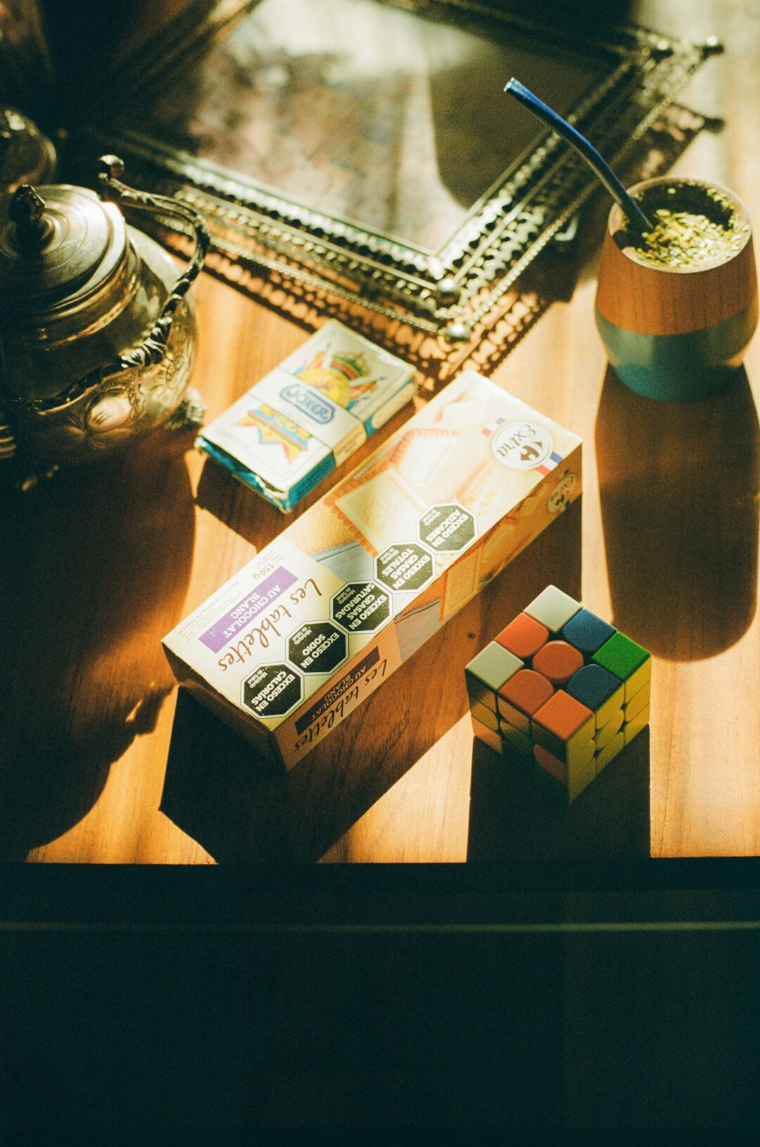 Camera equipment and film rolls on a wooden table